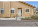 Welcoming home entrance with white door, sidelight windows and concrete steps for easy access at 10507 W Maplewood Dr # E, Littleton, CO 80127