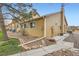 Exterior of a townhome with well-maintained landscaping and architectural details at 10507 W Maplewood Dr # E, Littleton, CO 80127