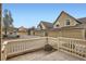 View of townhome exteriors showing the garage and entryway at 10507 W Maplewood Dr # E, Littleton, CO 80127