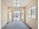 This room has updated carpet, neutral walls, and a modern light fixture at 10507 W Maplewood Dr # E, Littleton, CO 80127