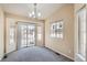Bright room with neutral walls, carpet, and sliding door access to the patio at 10507 W Maplewood Dr # E, Littleton, CO 80127