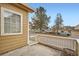 Cozy patio area with a view of the neighborhood, and adjacent street at 10507 W Maplewood Dr # E, Littleton, CO 80127