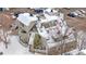 A charming townhouse with a snowy roof, multi-level balconies, and an inviting exterior for comfortable living at 12478 W Nevada Pl # 208, Lakewood, CO 80228