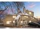Charming townhouse featuring a welcoming entrance, covered stairway, balcony, and well-maintained landscaping at 12478 W Nevada Pl # 208, Lakewood, CO 80228