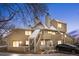 Charming townhouse featuring a welcoming entrance, covered stairway, balcony, and well-maintained landscaping at 12478 W Nevada Pl # 208, Lakewood, CO 80228