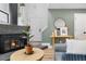 Stylish living room featuring a fireplace, hardwood floors, and modern decor at 12478 W Nevada Pl # 208, Lakewood, CO 80228