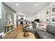 Inviting living room featuring a modern gray sofa, wood floors, and an open floorplan at 12478 W Nevada Pl # 208, Lakewood, CO 80228