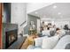 Welcoming living room showcasing a fireplace, stylish furniture, and seamless open floor plan at 12478 W Nevada Pl # 208, Lakewood, CO 80228
