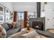 Cozy living room featuring a fireplace, comfortable seating, and abundant natural light at 12478 W Nevada Pl # 208, Lakewood, CO 80228