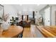 Open-concept living room features a cozy fireplace, a dedicated workspace, and bright, natural light at 12478 W Nevada Pl # 208, Lakewood, CO 80228