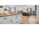 Open living space with kitchen, dining, and living areas, featuring wood floors and natural light at 12478 W Nevada Pl # 208, Lakewood, CO 80228