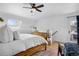 Bright main bedroom with skylight, light hardwood floors, leading to ensuite bath at 12478 W Nevada Pl # 208, Lakewood, CO 80228