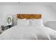 Stylish main bedroom with minimalist decor, accent mirror, and light, airy ambiance at 12478 W Nevada Pl # 208, Lakewood, CO 80228