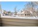 Scenic view from a deck overlooking the complex and parking lot on a snowy day at 12478 W Nevada Pl # 208, Lakewood, CO 80228
