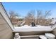 Rooftop view showcasing the surrounding neighborhood and a snow-covered mountain range in the distance at 12478 W Nevada Pl # 208, Lakewood, CO 80228