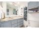 Well-lit bathroom with updated vanity, granite countertop, and ample storage at 7801 W 35Th Ave # 301, Wheat Ridge, CO 80033