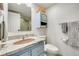 Bathroom with updated vanity, granite countertop, and shower at 7801 W 35Th Ave # 301, Wheat Ridge, CO 80033