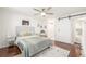 Cozy bedroom with a sliding barn door leading to the en-suite bathroom at 7801 W 35Th Ave # 301, Wheat Ridge, CO 80033