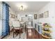 Bright dining room with a table and chairs and view of the kitchen at 7801 W 35Th Ave # 301, Wheat Ridge, CO 80033