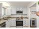 Bright kitchen with stainless steel appliances, granite countertops, and white cabinets at 7801 W 35Th Ave # 301, Wheat Ridge, CO 80033