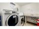 On-site laundry room features newer washing machines, plus a sink and counter area for folding clothes at 7801 W 35Th Ave # 301, Wheat Ridge, CO 80033