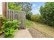 Private backyard featuring a charming wooden fence, lush greenery, and a serene grassy area at 1653 S Blackhawk Way # B, Aurora, CO 80012