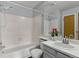 Bathroom with a bathtub, shower, and tiled walls at 1653 S Blackhawk Way # B, Aurora, CO 80012