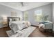 Bright bedroom featuring wood floors, a ceiling fan, and neutral decor at 1653 S Blackhawk Way # B, Aurora, CO 80012