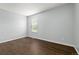 Empty bedroom featuring hard surface floors and a bright window at 1653 S Blackhawk Way # B, Aurora, CO 80012