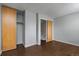 Spacious bedroom featuring closet and wood-look flooring at 1653 S Blackhawk Way # B, Aurora, CO 80012