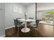 Chic dining area with a white marble table, velvet chairs, and modern decor at 1653 S Blackhawk Way # B, Aurora, CO 80012