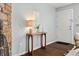 Welcoming entryway with stylish console table and stone fireplace at 1653 S Blackhawk Way # B, Aurora, CO 80012