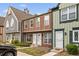 Townhome exterior with multiple units and neatly trimmed front yard at 1653 S Blackhawk Way # B, Aurora, CO 80012