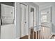 Hallway shows in unit washer/dryer with bedroom and bathroom views at 1653 S Blackhawk Way # B, Aurora, CO 80012