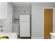 Kitchen features white countertops and appliances with wood flooring at 1653 S Blackhawk Way # B, Aurora, CO 80012