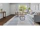Bright living room with modern decor, soft blue walls, and natural light at 1653 S Blackhawk Way # B, Aurora, CO 80012