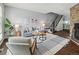 Comfortable living room with stylish decor, a staircase, and a fireplace at 1653 S Blackhawk Way # B, Aurora, CO 80012