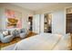 Bright bedroom with ensuite bathroom and sitting area at 825 Circle Dr, Boulder, CO 80302