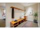 Inviting entryway with bench, storage, and wood shelving at 825 Circle Dr, Boulder, CO 80302