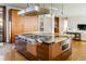 Large kitchen island with granite top and built-in appliances at 825 Circle Dr, Boulder, CO 80302