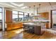 Bright kitchen with wood cabinetry, granite counters, and expansive windows at 825 Circle Dr, Boulder, CO 80302