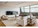 Living room with fireplace, large windows and city views at 825 Circle Dr, Boulder, CO 80302