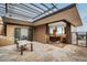 Covered patio with stone flooring and connection to kitchen at 825 Circle Dr, Boulder, CO 80302