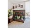 Stylish fireplace with plants and decor next to sliding door to a balcony at 805 29Th St # 308, Boulder, CO 80303