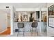 Kitchen bar with a corrugated metal base and seating for two at 805 29Th St # 308, Boulder, CO 80303