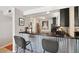 Open kitchen layout with stainless steel appliances, stylish countertop seating, and modern finishes at 805 29Th St # 308, Boulder, CO 80303