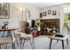 Cozy living room boasts a decorative fireplace, sleek furnishings, and access to the balcony at 805 29Th St # 308, Boulder, CO 80303
