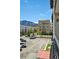 Scenic view from the balcony showcases well-maintained landscaping, nearby mountains, and beautiful blue sky at 805 29Th St # 308, Boulder, CO 80303