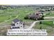 Stunning aerial view of a modern home on a golf course with mountain views at 19887 Kershaw Ct, Monument, CO 80132