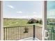 Golf course view from a private balcony with black metal railing and beautiful clear blue skies at 19887 Kershaw Ct, Monument, CO 80132